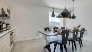 A modern kitchen with a dining area. - Château by Interhome (Porto Vecchio)