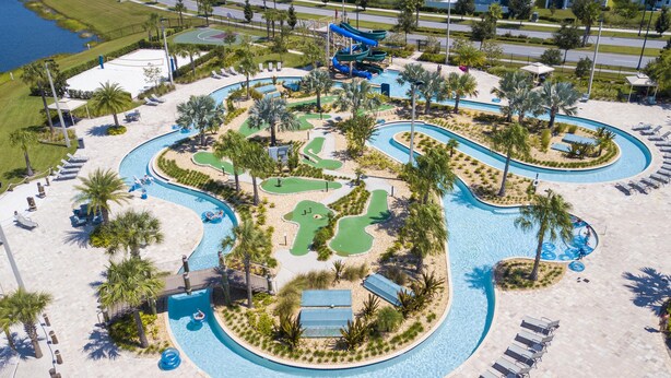 An aerial view of a resort with a large pool, water slides, and a golf course. - 4764- Great Family Home near Disney, Pool & Spa - Storey Lake Resort (Kissimmee)