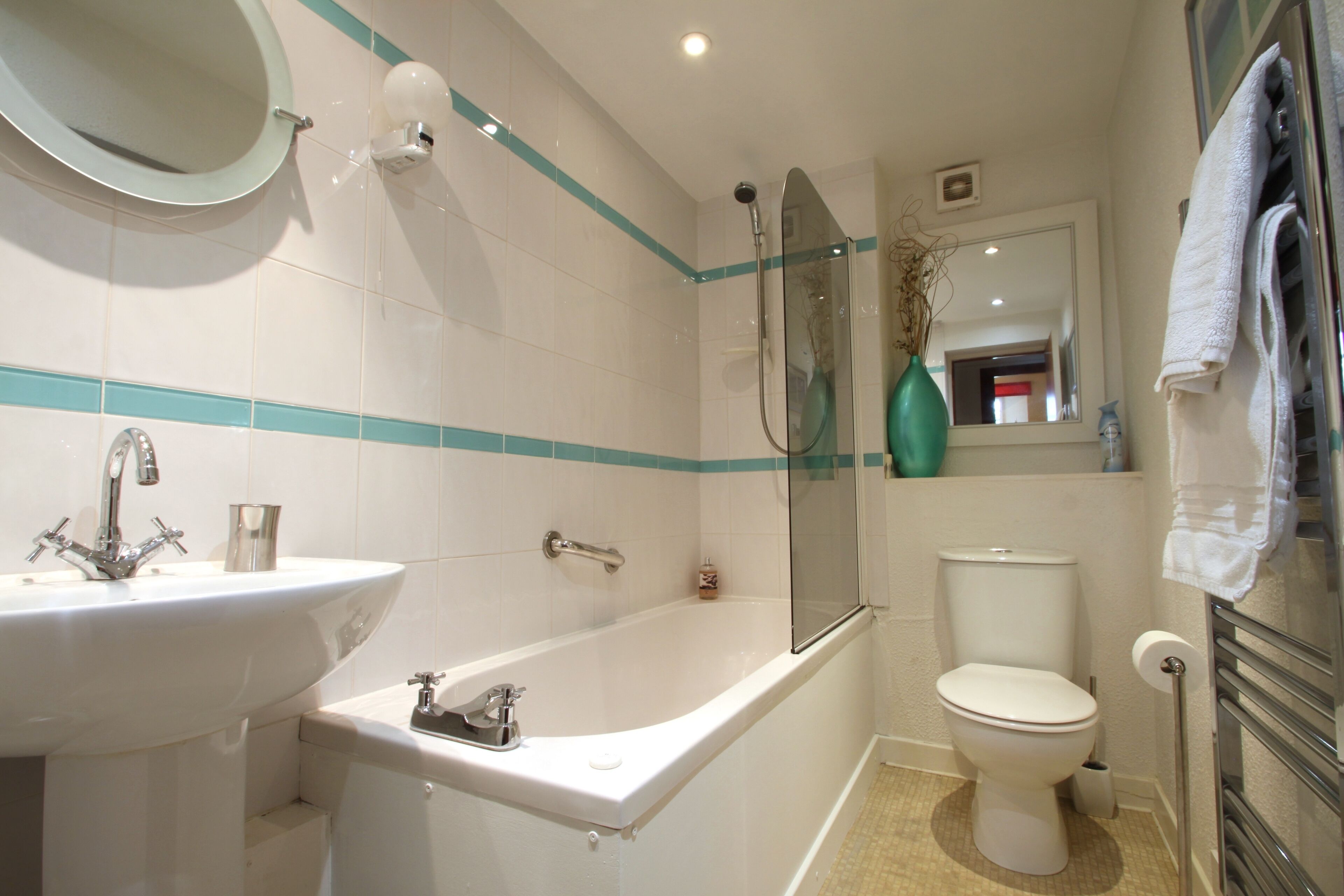 Combined shower/bathtub, hair dryer, towels, soap