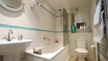 Combined shower/bathtub, hair dryer, towels, soap