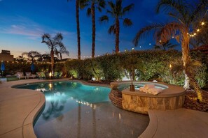 A swimming pool with a hot tub, surrounded by palm trees and outdoor seating. - Bliss: Pool, Spa, Pool Table, Ping Pong, Fire Pit! (Indio)