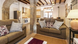 A cozy living room with two sofas, a rug, and a lamp. - Can Bodeguita, Wifi, Private pool and terrace. (Binissalem)