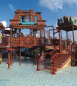 Enjoy water park fun with slides and climbing areas.