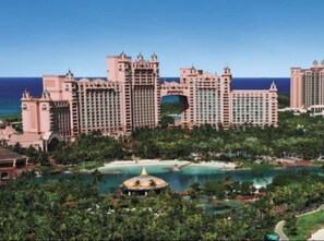 Surrounded by lush greenery and a serene body of water, this hotel offers stunning views from its many balconies.