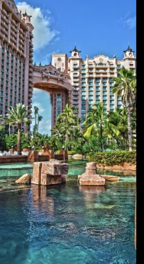 Stunning water feature surrounded by lush greenery and classic architecture.