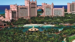 A large resort with multiple high-rise buildings, a central courtyard, and a pool area. - Vacation Rental Villa sleeps 4;Harborside Resort at Atlantis, Bahamas; Dec16-21 (Paradise Island)