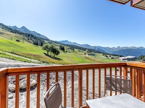 Enjoy dining or relaxing on the deck with a view of the surrounding mountains.