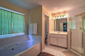 Traditional House | Bathroom | Separate tub and shower, towels, toilet paper