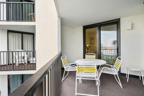 Relax on the balcony with a round table and six chairs, perfect for taking in the view.