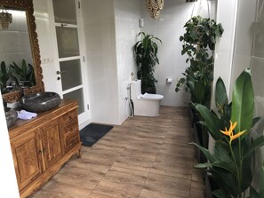 Bathtub, bidet, towels, soap