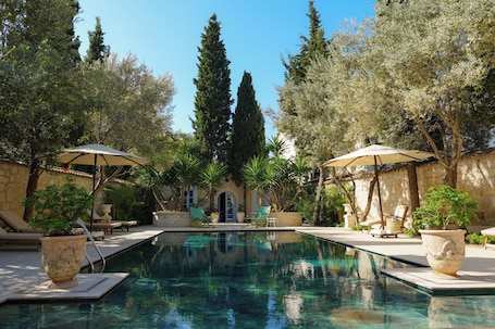 Outdoor pool, open 6:00 AM to 9:00 PM, pool umbrellas, pool loungers. Tas Otel