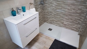 Shower, hair dryer, towels, shampoo