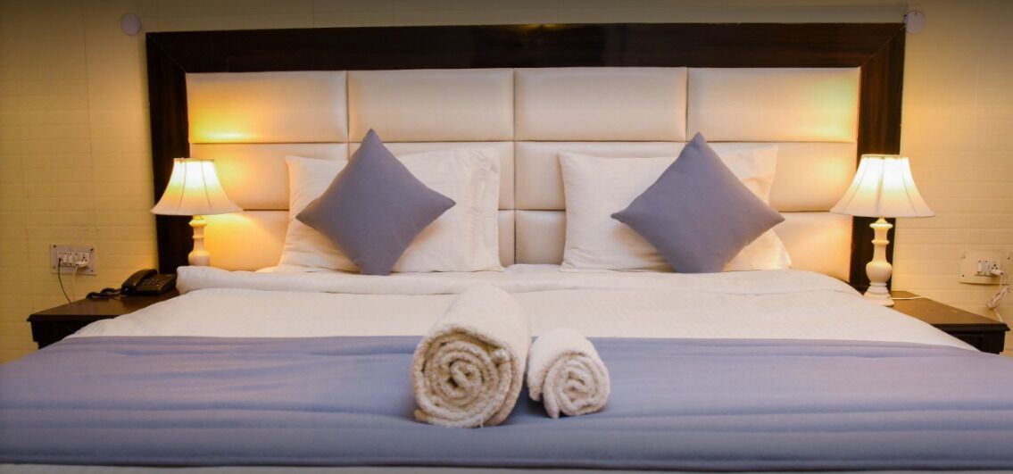 Premium Room | Individually furnished, blackout drapes, iron/ironing board, free WiFi