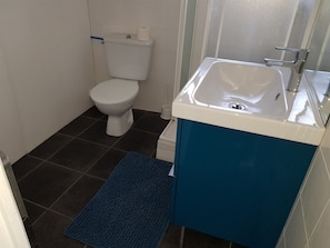 Shower, towels, soap, toilet paper