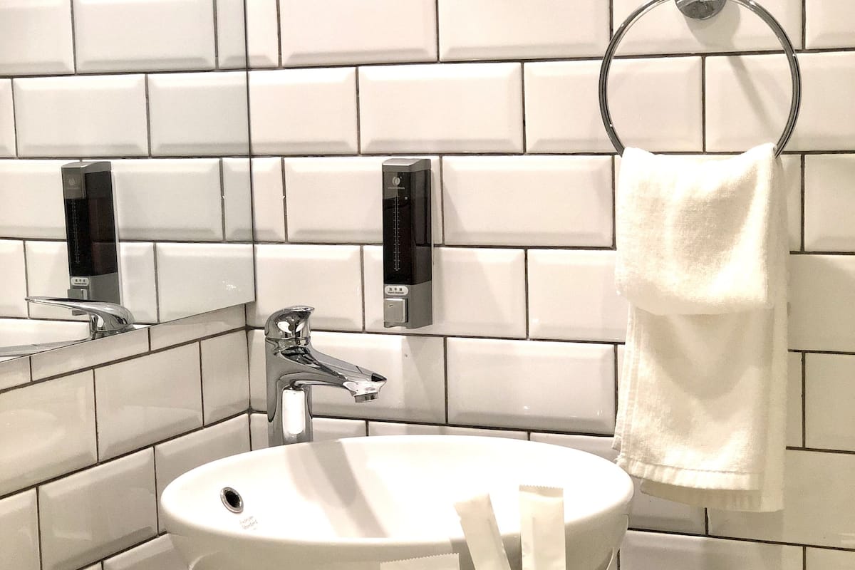 superior twin room | bathroom amenities | shower, free toiletries, slippers, towels