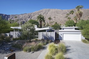Set amidst a serene landscaped garden, this property offers a living environment with a garage.