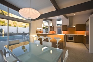 Enjoy cooking in this well-lit kitchen with a central island and ample counter space.