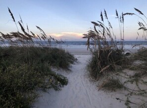 A beach path leading to the ocean with tall grasses and sand. - Beautiful Beach Home (St. Augustine)