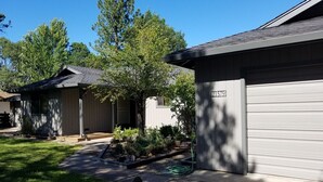A residential area with two houses, each with a garage door and a number plate. -  Cassel, Ca. on Hat Creek. Close/Baum Lake, Burney, Mt. Shasta/Lassen 3 nite min (Cassel)
