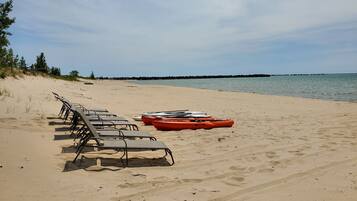 On the beach, sun loungers, beach towels