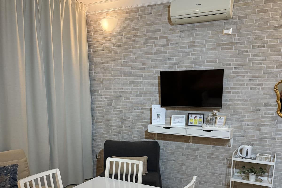 Family Studio | Living area | Flat-screen TV