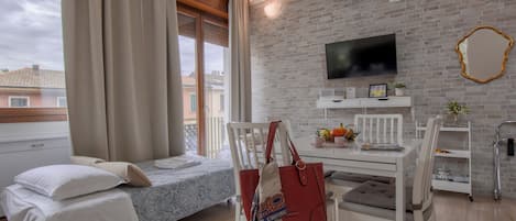 Family Studio | Premium bedding, down comforters, iron/ironing board, free WiFi