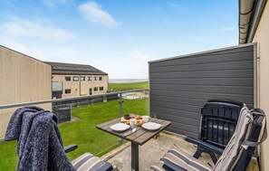 Enjoy al fresco dining and take in the serene views from this balcony.