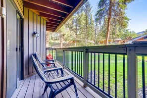 A covered outdoor deck with a railing, a table, and two chairs. - Kick back in our Keystone getaway! Near Slopes (Keystone)