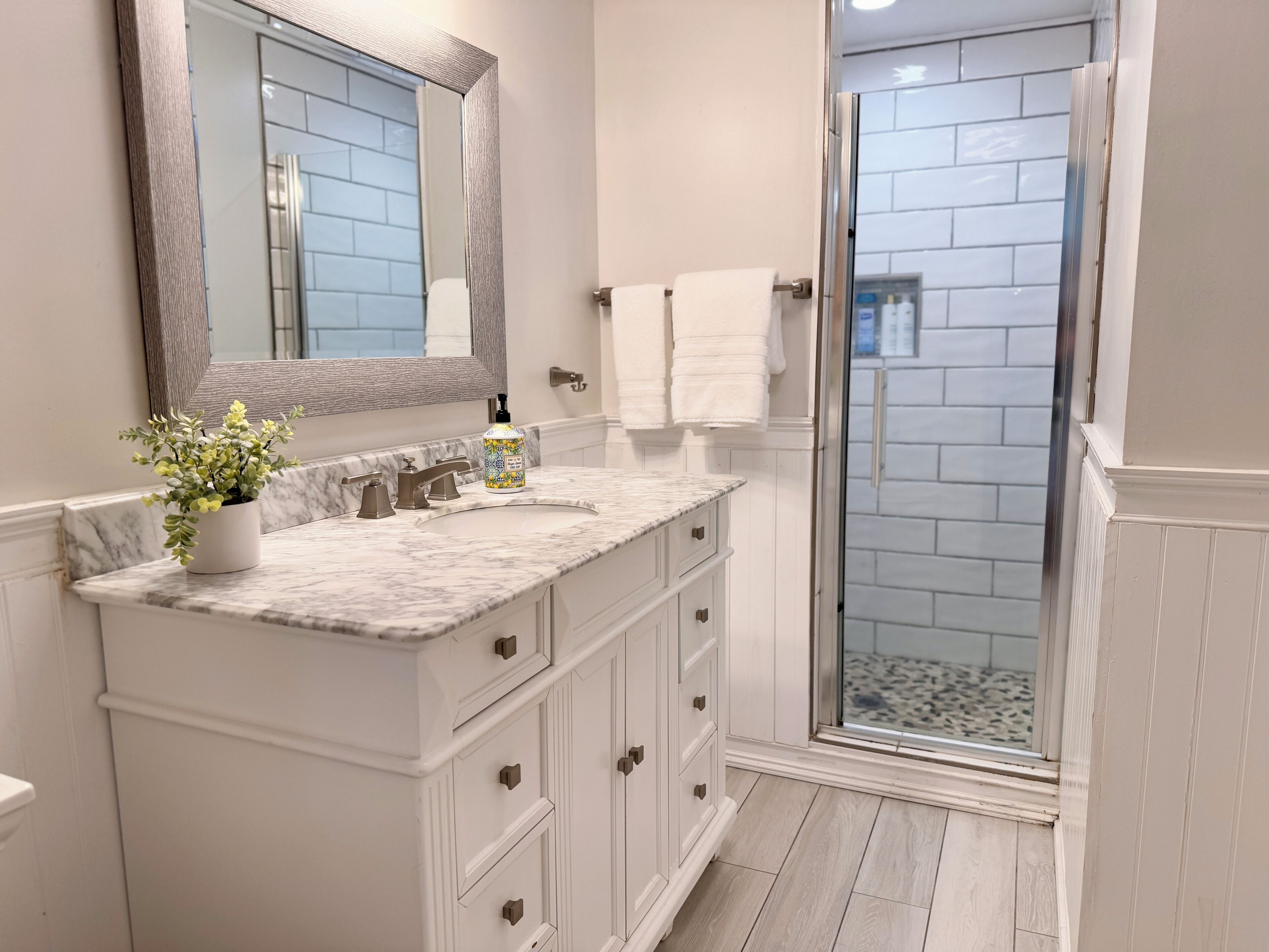 Combined shower/tub, hair dryer, towels, soap