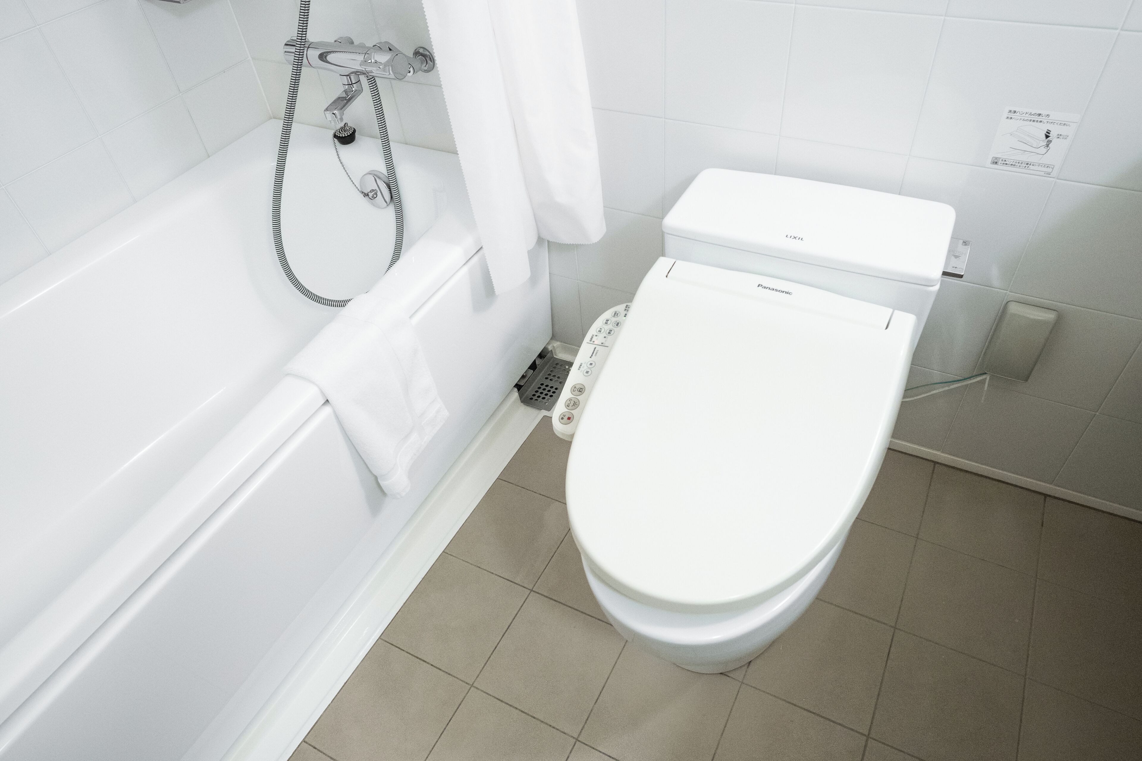 signature suite (non-smoking) | bathroom | combined shower/bathtub, eco-friendly toiletries, hair dryer, slippers