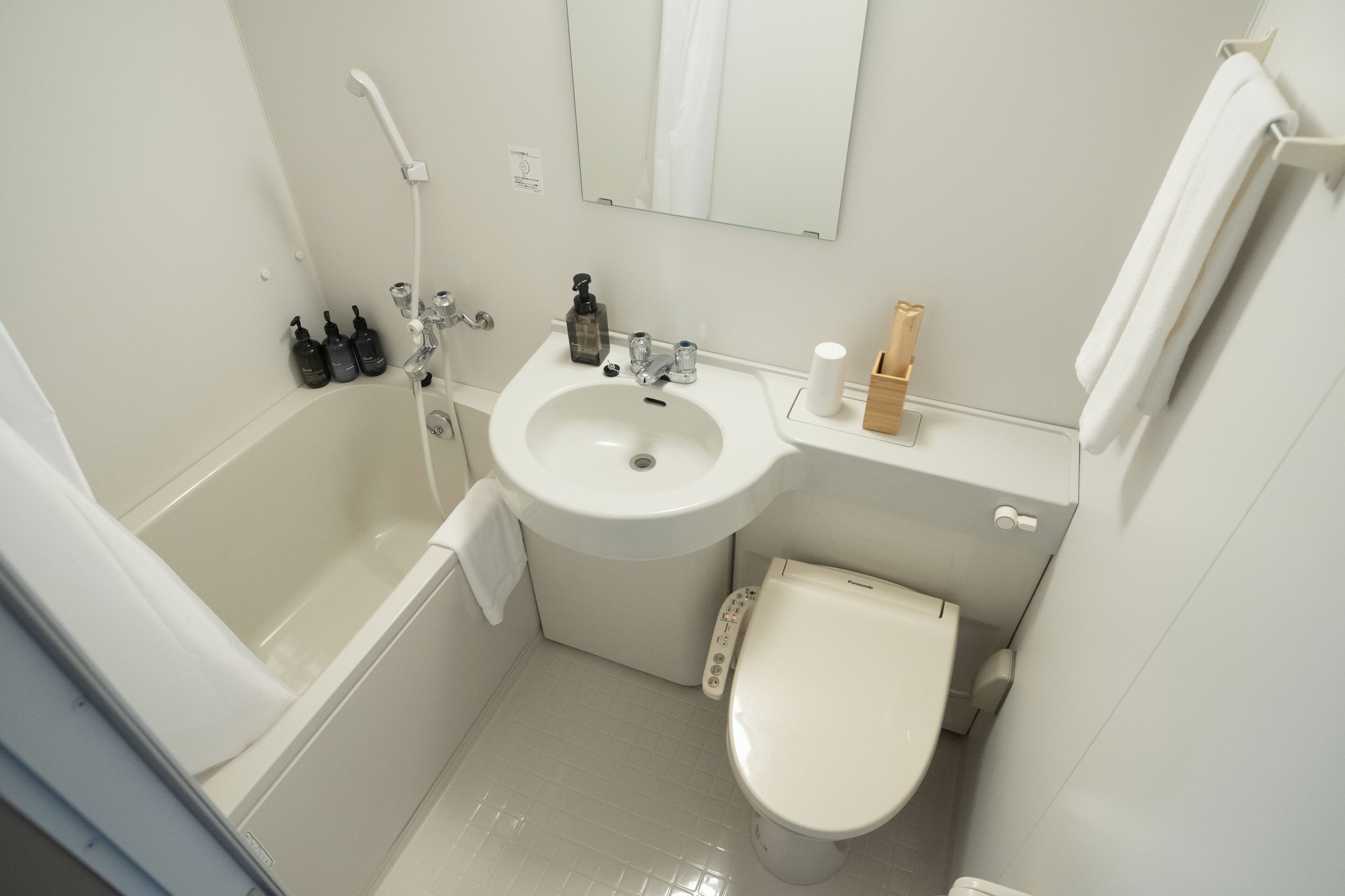 signature double room (non-smoking) | bathroom | combined shower/bathtub, eco-friendly toiletries, hair dryer, slippers