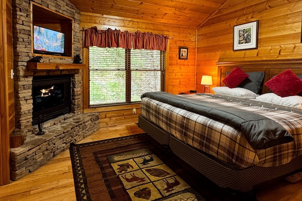 Relax at night with the cozy, romantic ambience of the gas fireplace in the Master bedroom with a king-size bed! The satellite TV has hundreds of options for entertainment.