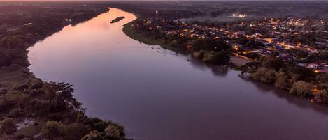 A river winding through a town with buildings on both sides.