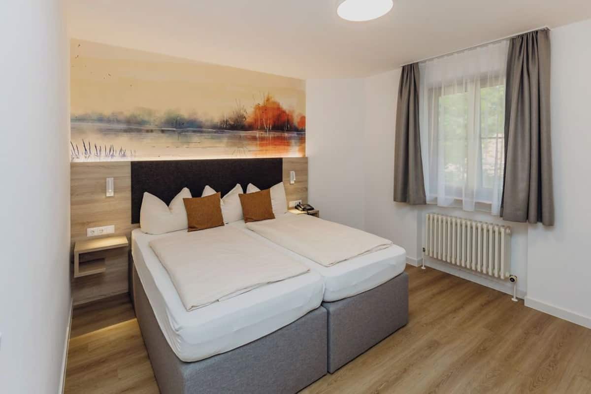 basic double room, courtyard area | desk, blackout curtains, iron/ironing board, cots/infant beds