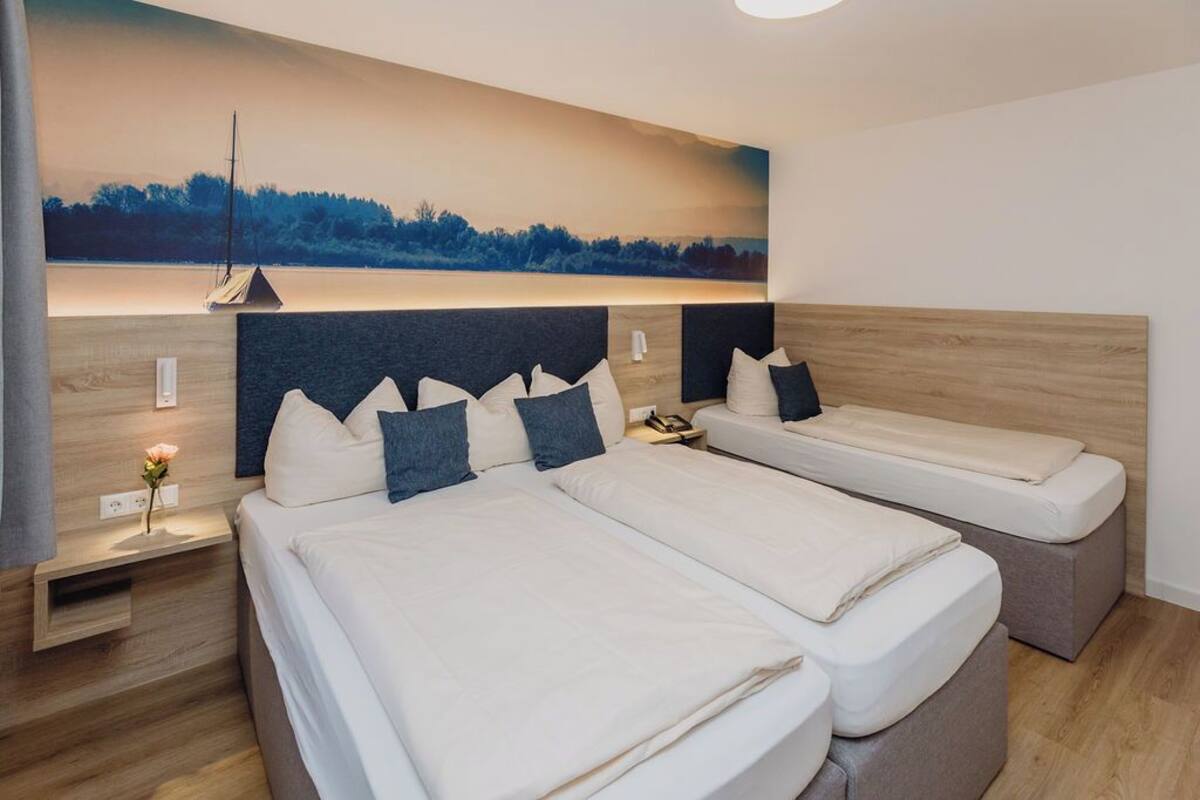 triple room | desk, blackout curtains, iron/ironing board, cots/infant beds