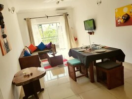 Design Apartment, 2 Bedrooms, Non Smoking, Balcony | Living area | 32-inch flat-screen TV with satellite channels, TV