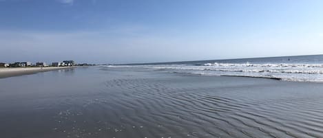 On the beach, surfing