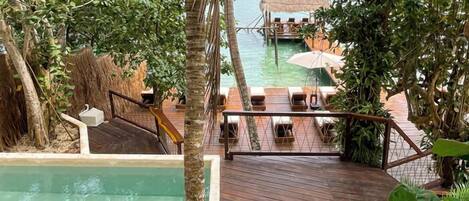 Outdoor pool, open 8:00 AM to 8:00 PM, pool umbrellas