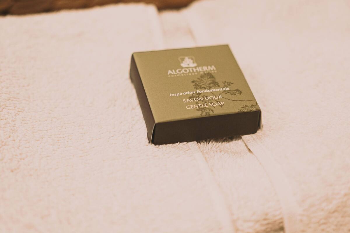 A box of Algothem Gentle Soap on a white towel.