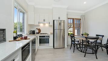 Executive House | Private kitchen | Full-sized fridge, microwave, oven, stovetop