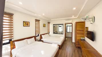 Family Room | Minibar, in-room safe, desk, laptop workspace