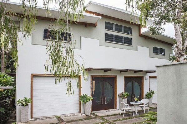 Stylish two-story home with a patio and clean lines.