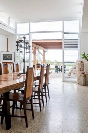 Enjoy meals in this dining area with a long table and comfortable seating for all.