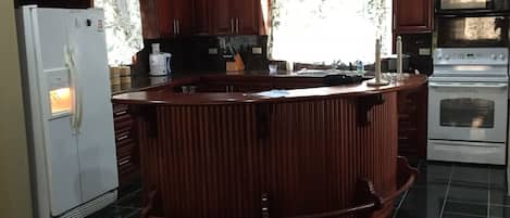 Microwave, coffee/tea maker, cookware/dishes/utensils