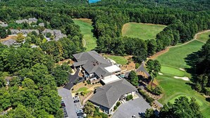 An aerial view of a residential area with houses, a golf course, and a lake in the background. - Views, Pools & Marina: Lake Keowee Condo! (Salem)