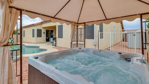 A hot tub under a canopy, surrounded by a pool and a patio area with a fence. - 4 Mi to Riparian Preserve: Mesa Abode w/ Hot Tub (Mesa)