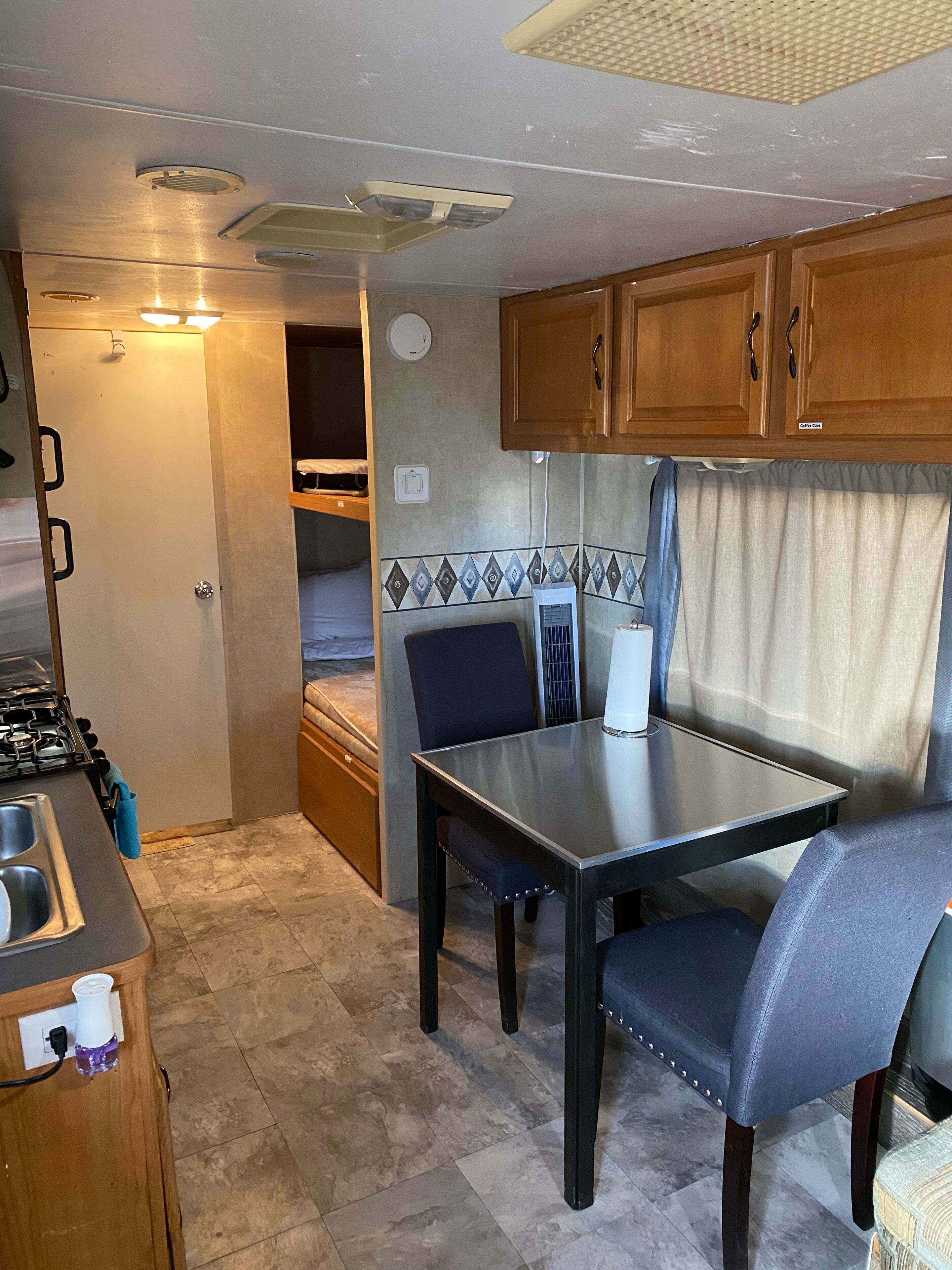 RV1 Camper privacy of your own with 50 amp EV charging outlet available.