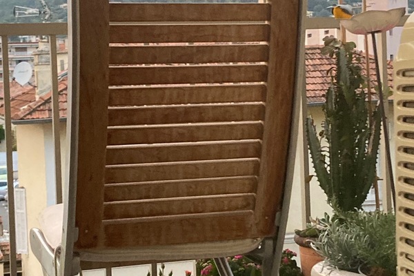 View of mountains and historic village from studio apartment balcony.