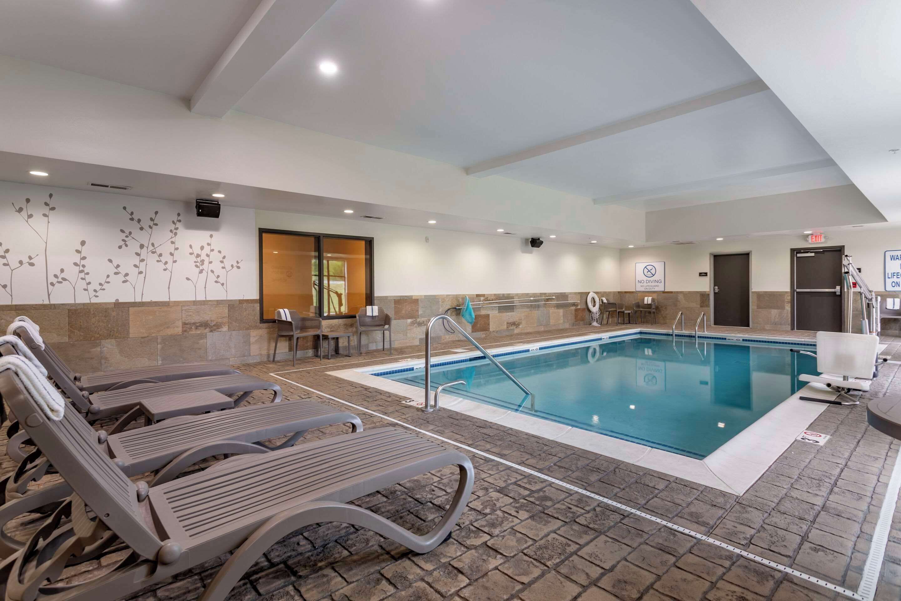 indoor pool, open 7:00 am to 10:00 pm, pool loungers