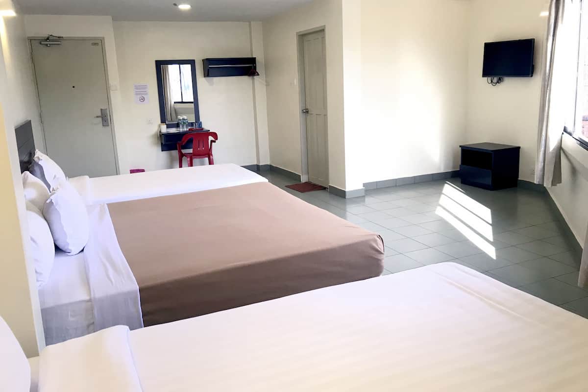 Deluxe Quadruple Room | Blackout drapes, iron/ironing board, WiFi (free), bed sheets